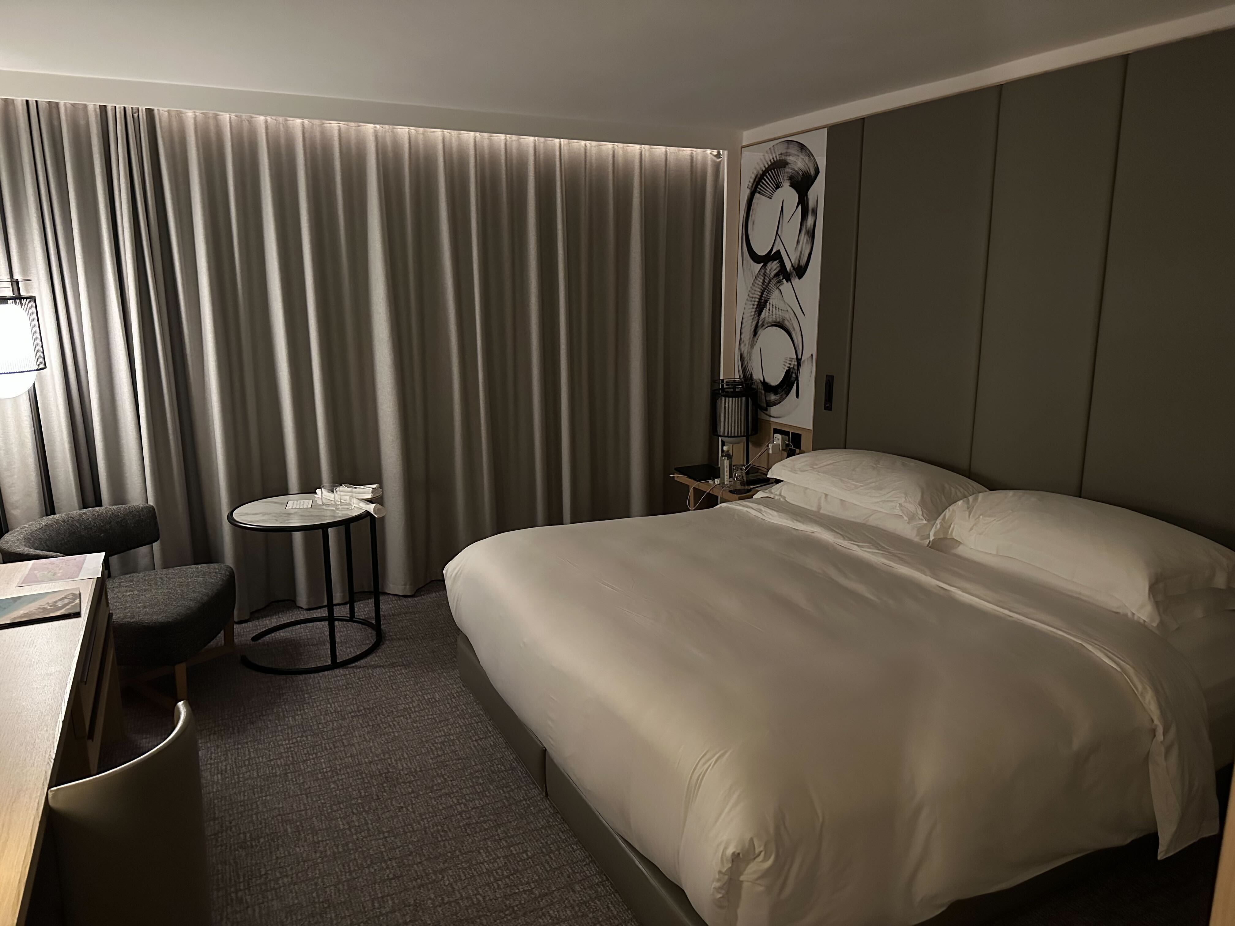 Guest room at Nobu Hotel London with minimalist design and warm lighting