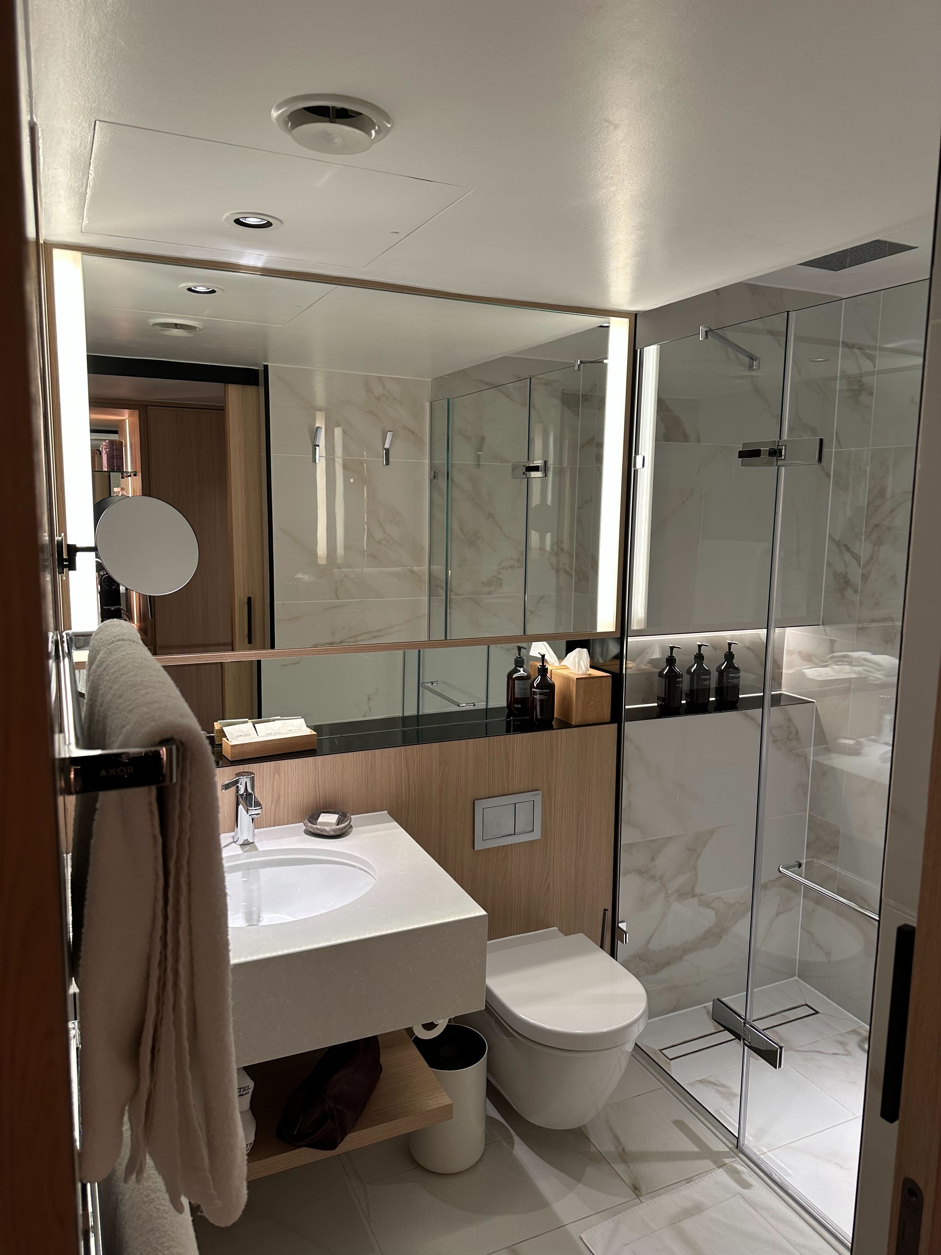 Bedroom corner at Nobu Hotel London with seating area and soft lighting